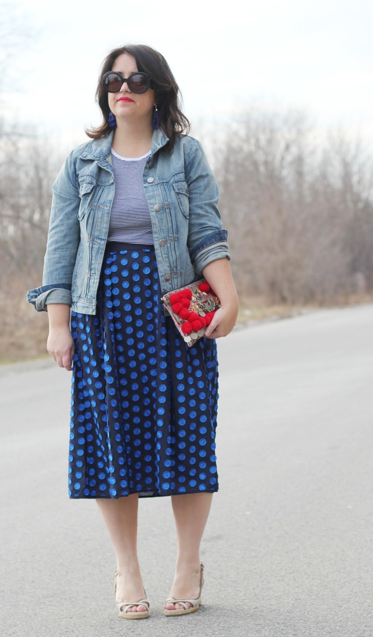 polka dot skirt with jean jacket and embellished clutch, spring outfit ideas