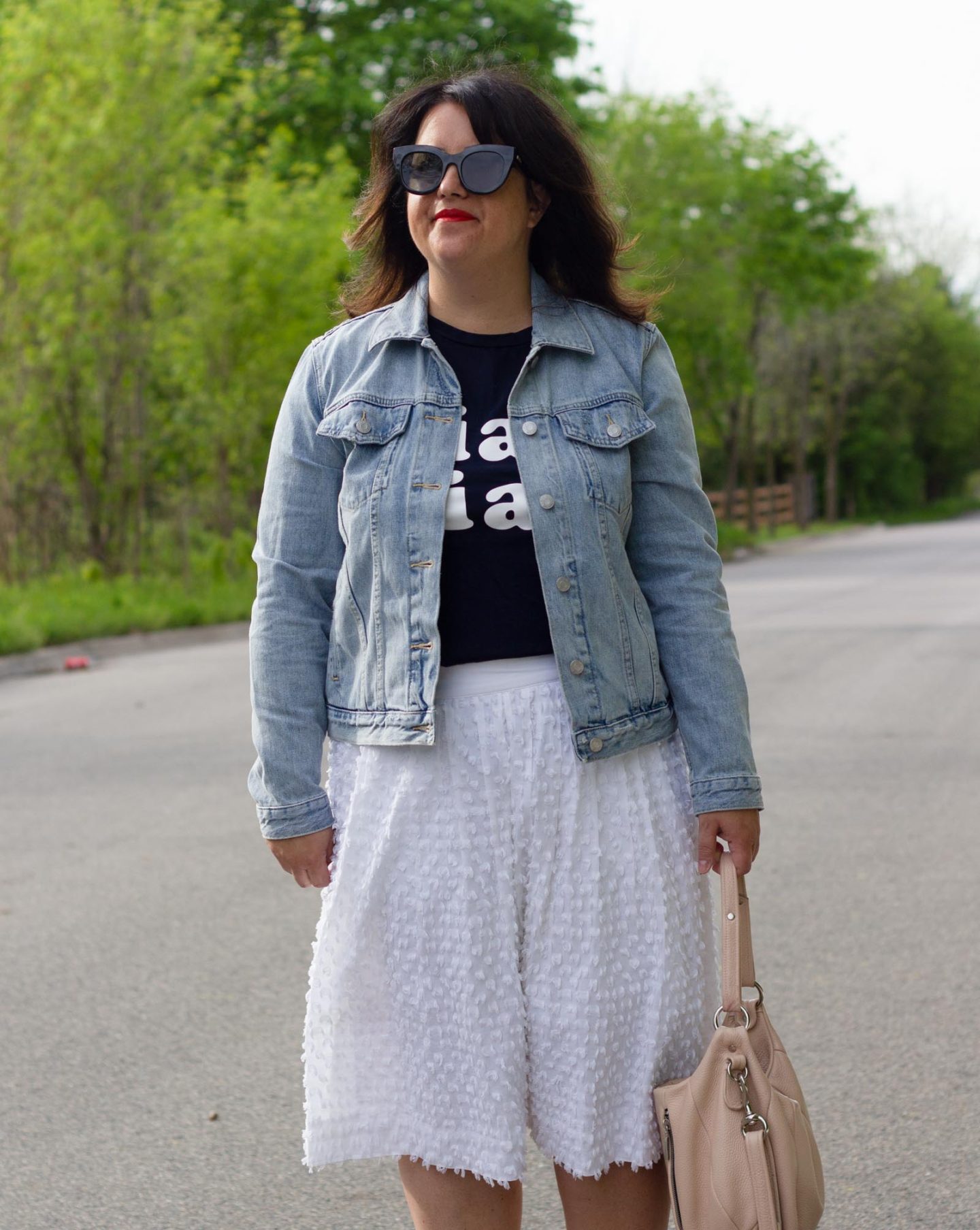 graphic tee and white skirt