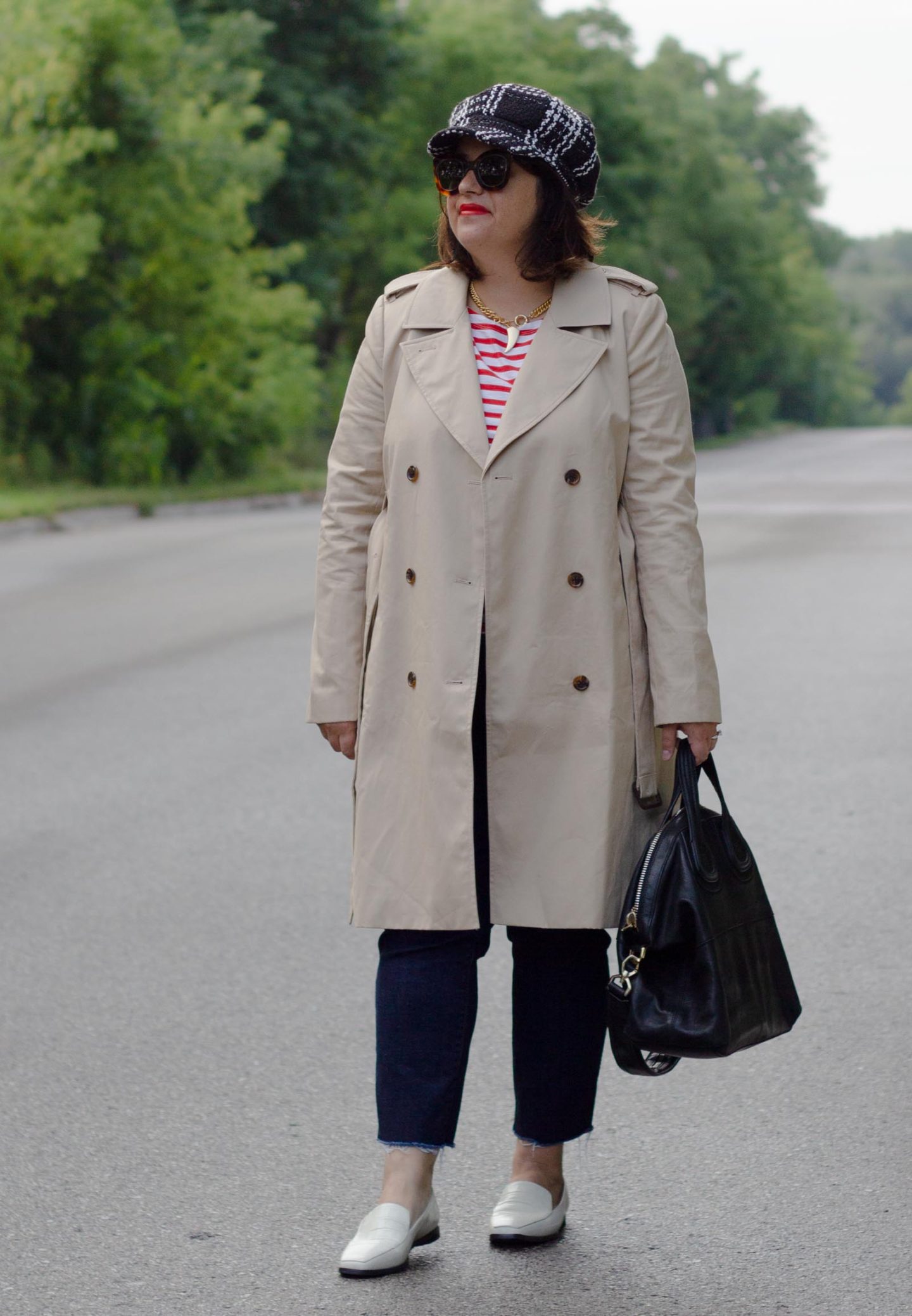 trench, white loafers, red stripe tee