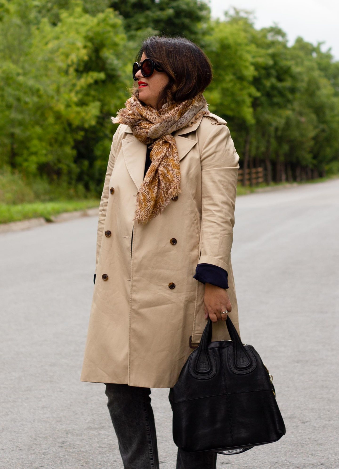 trench coat with black jeans and snake scarf