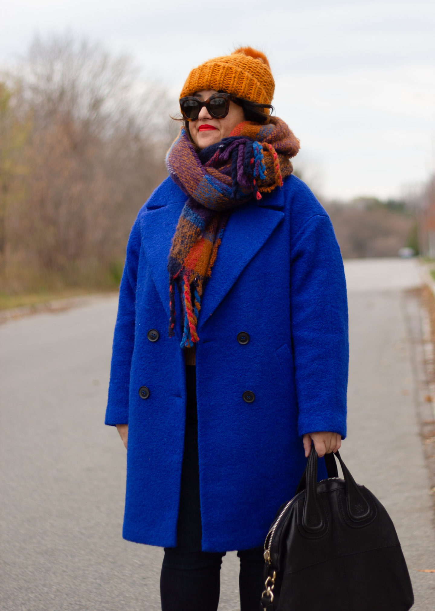 blue coat with brown accessories