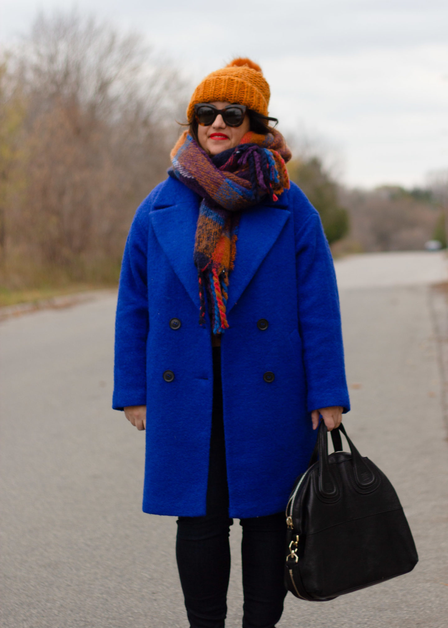 blue coat with brown accessories