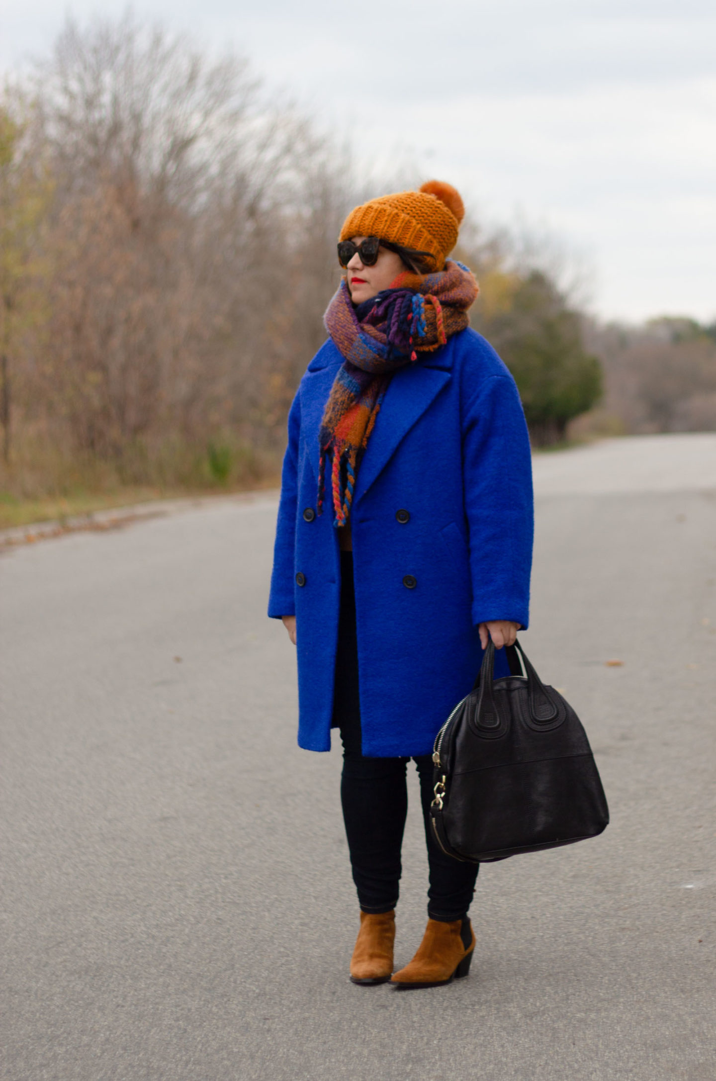 blue coat with brown accessories
