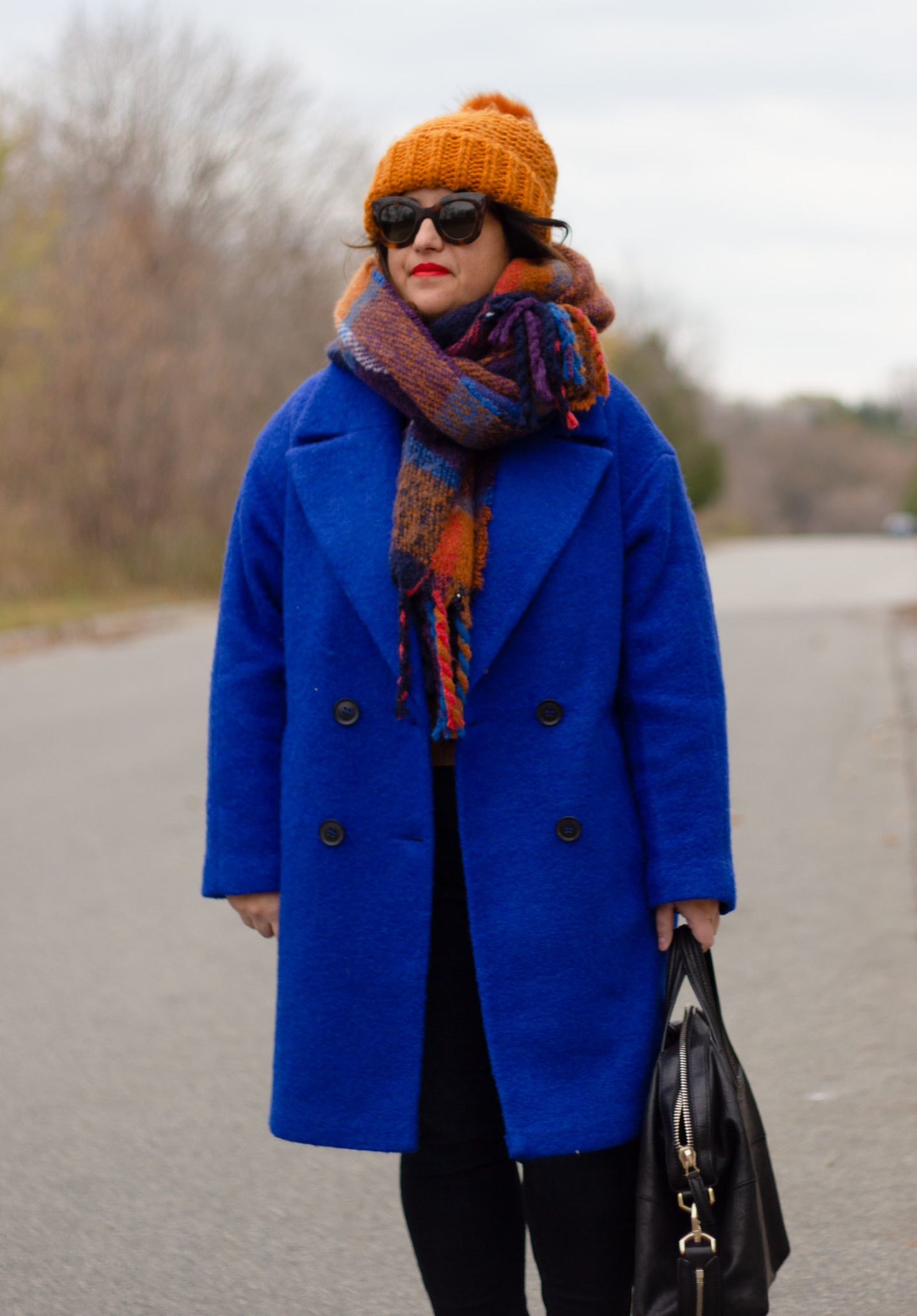 blue coat with brown accessories