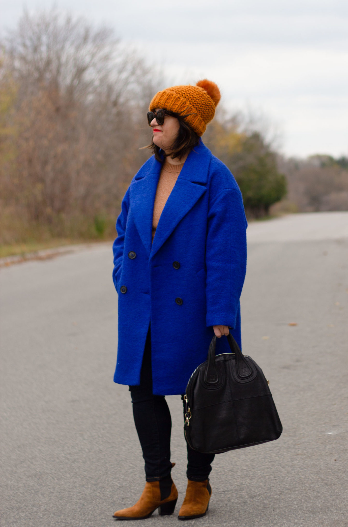 blue coat with brown accessories