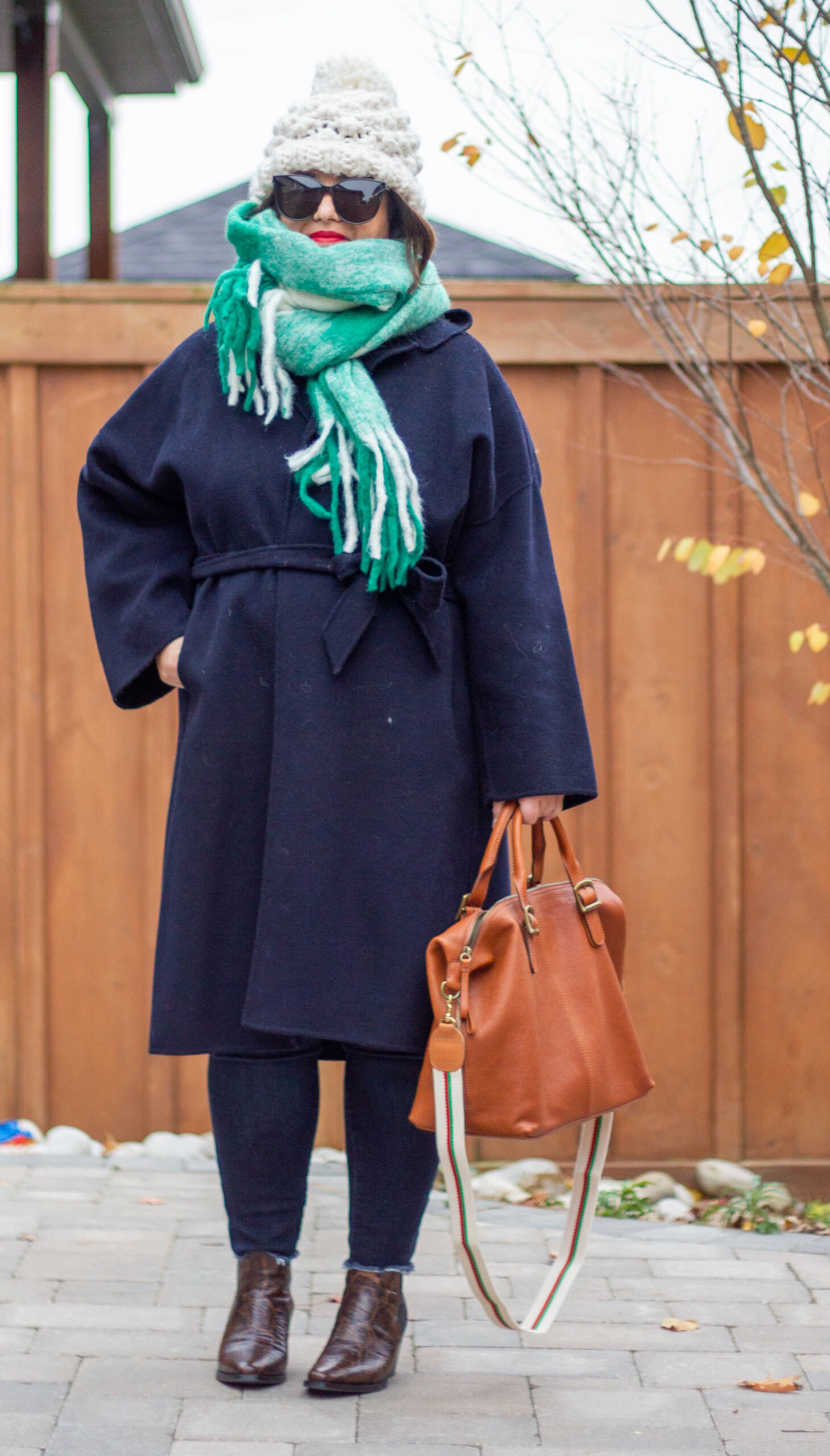 green scarf and navy belted coat outfit