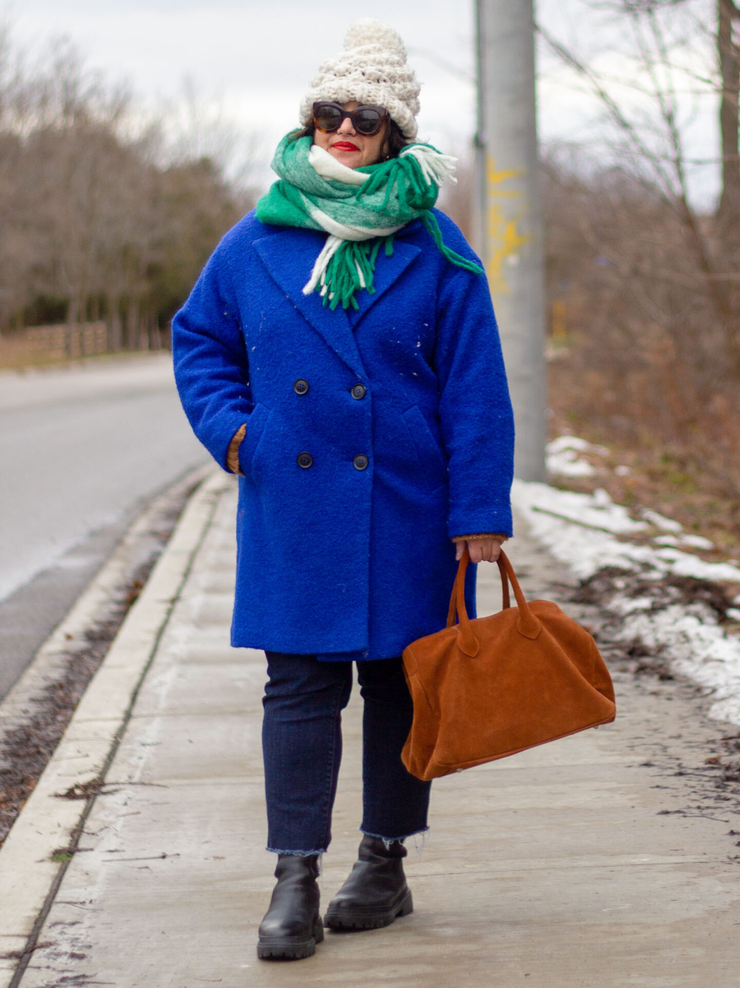 blue coat with green scarf