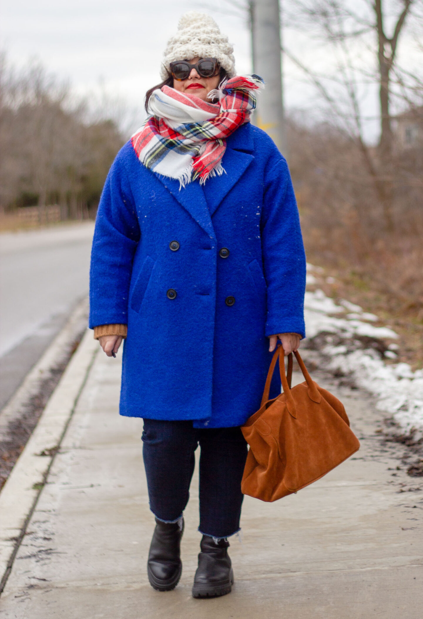 bright blue coat with plaid scarf