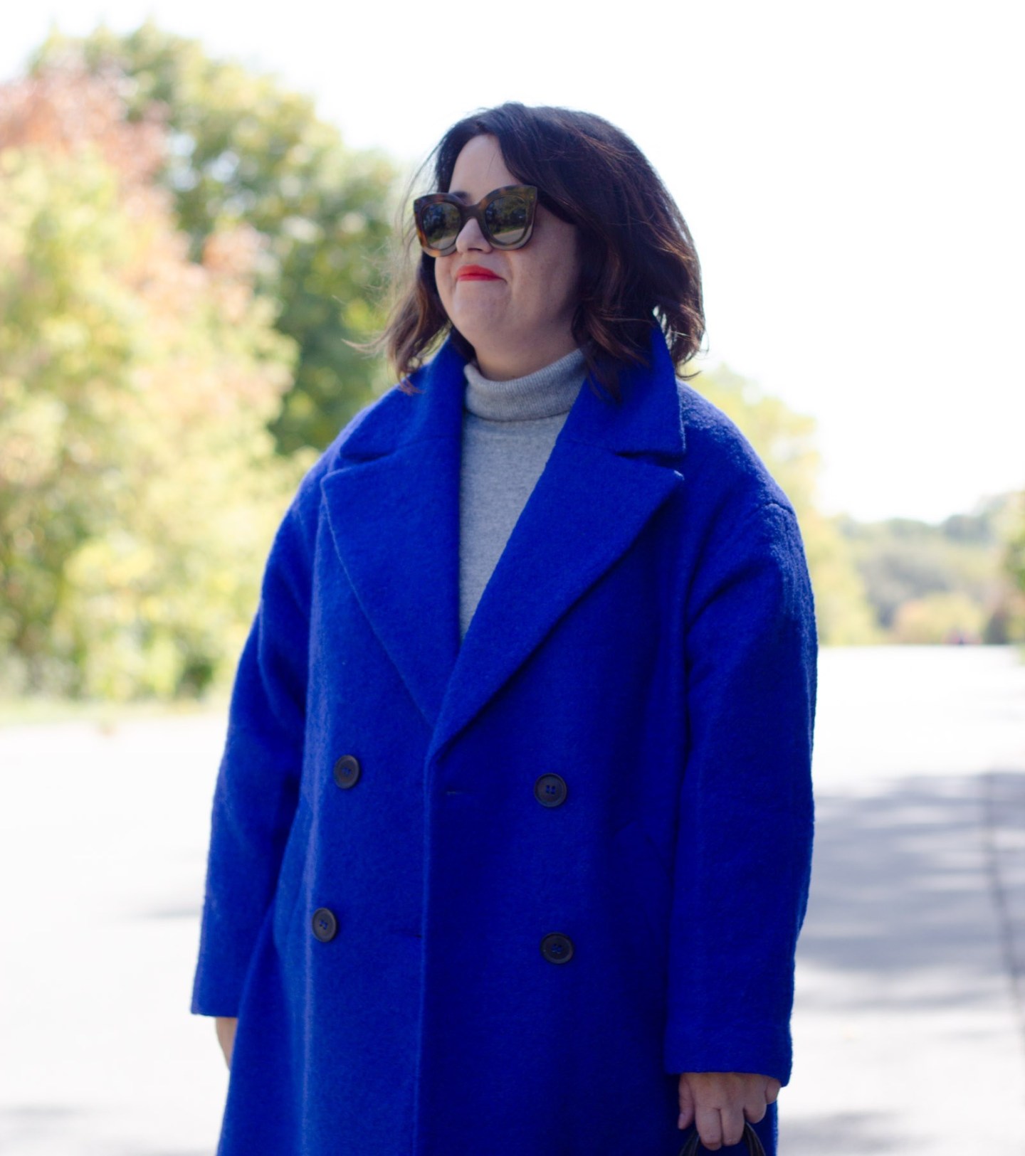 blue coat with grey sweater