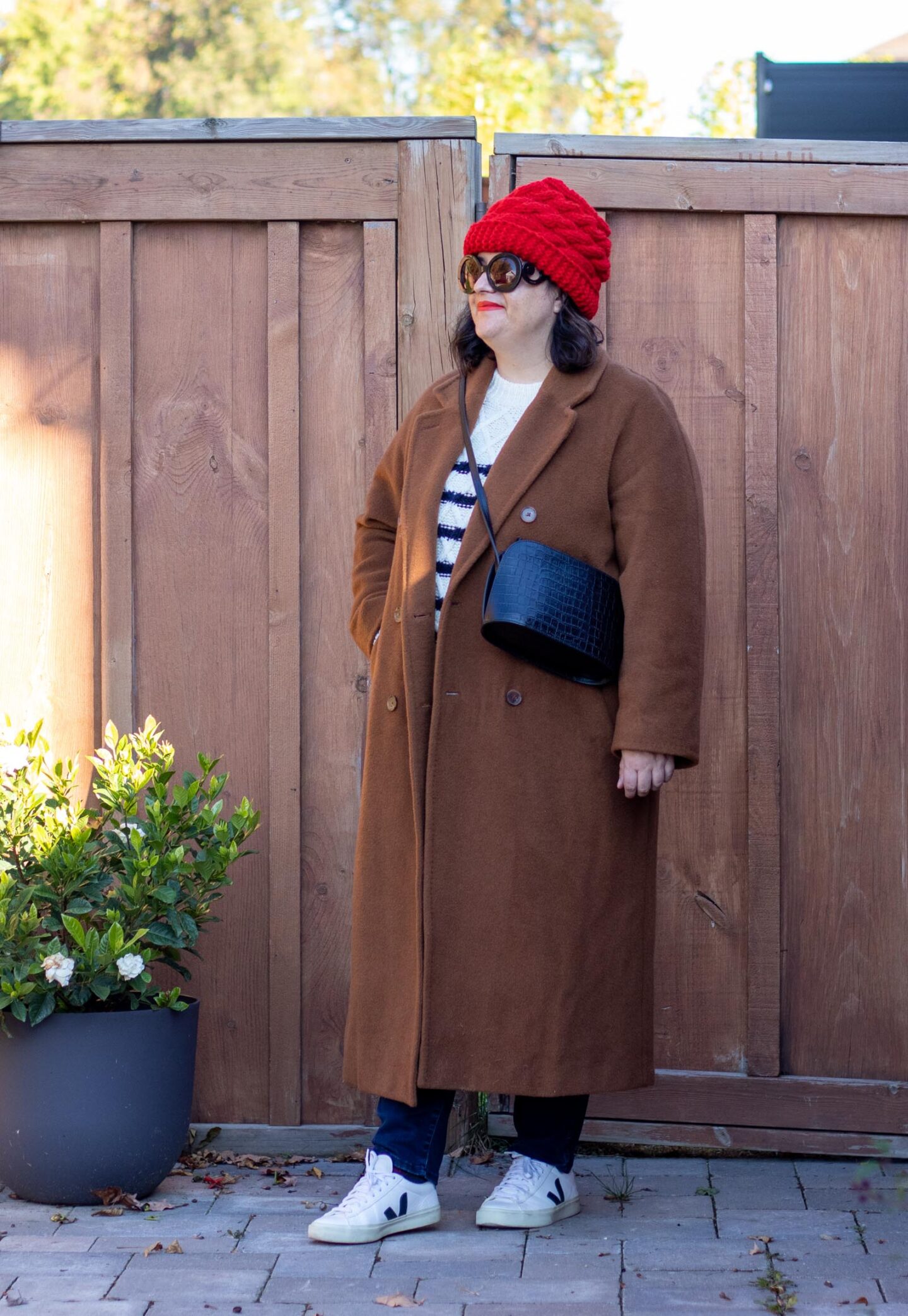 camel coat, stripe sweater, veja sneakers, red beanie outfit