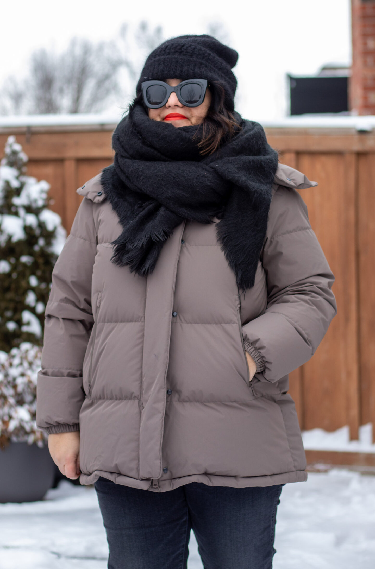 neutral puffer with black winter accessories