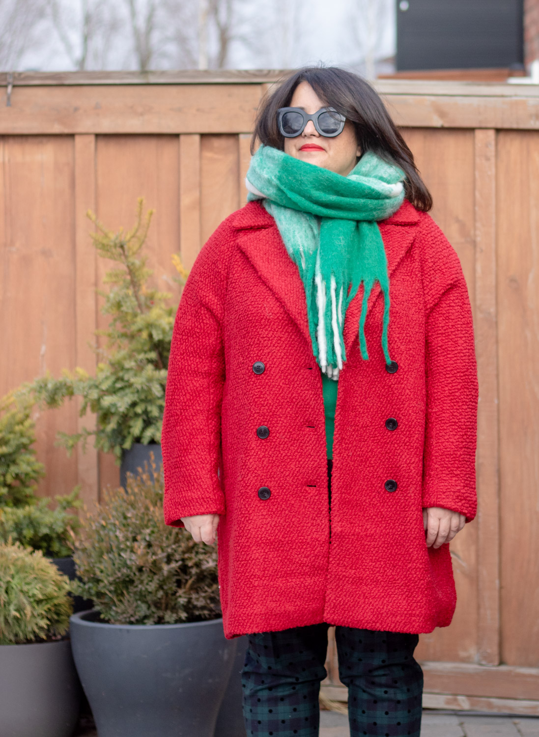 red coat, green check scarf
