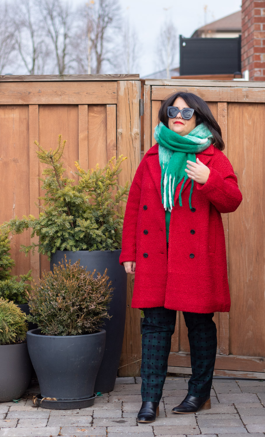 red coat, green check scarf