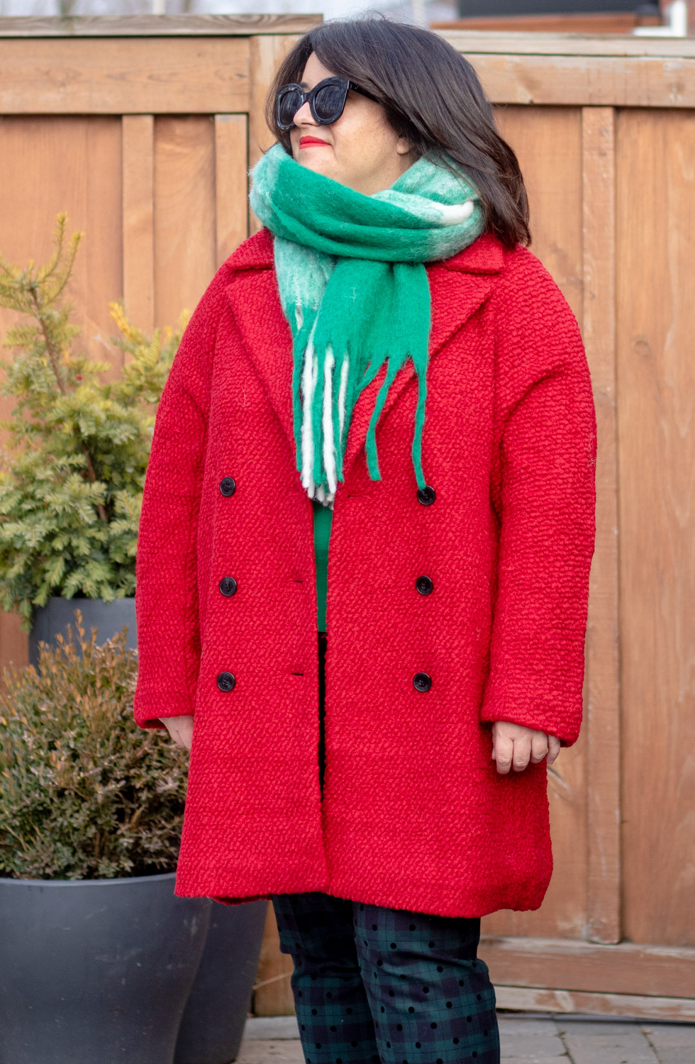 red coat green and white scarf