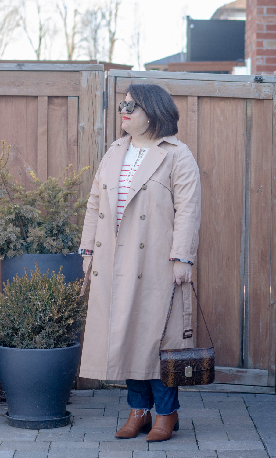 trench and red stripe sweater outfit